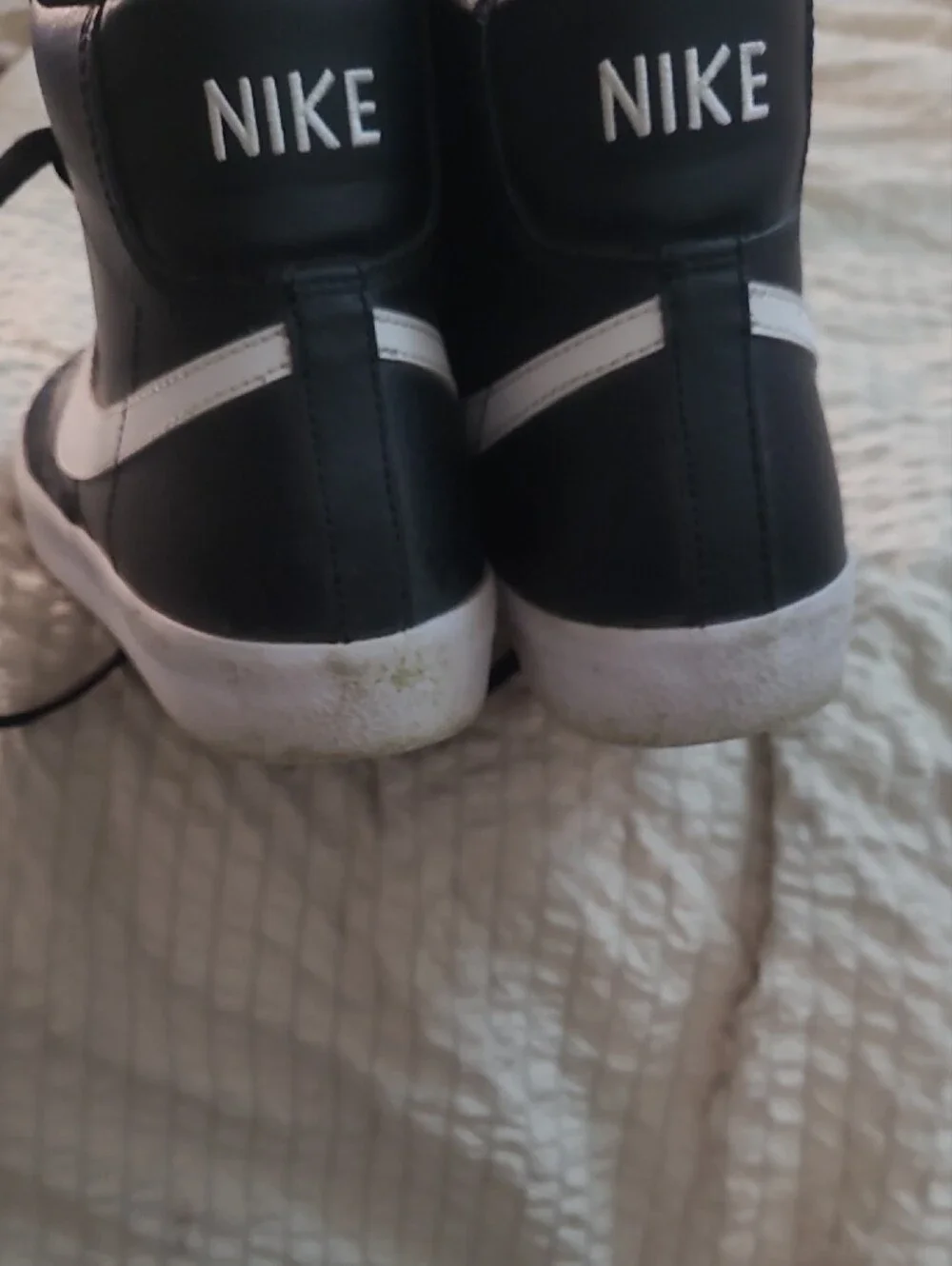 Nike Black High-Top Sneaker with White Swoosh